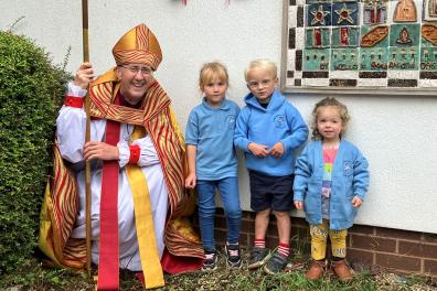 Bishop Michael Beasley at Little Herons Nursery.