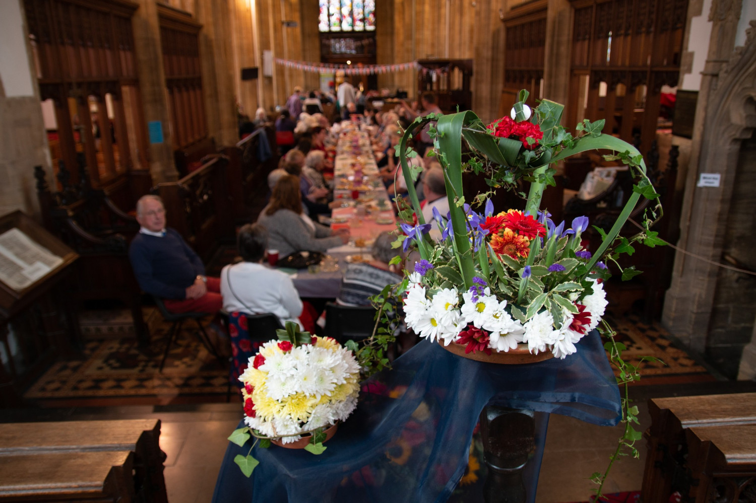 St John's Yeovil gathering with floral display